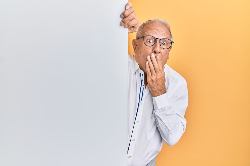 An old man oopsing behind a wall - Common copywriting mistakes